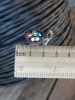 Фотография среза кабеля АВВГ 5х4 с алюминиевыми монолитными жилами в разноцветной изоляции