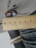 Фотография сечения кабеля ВВГнг 4х6, который намотан на деревянный барабан
